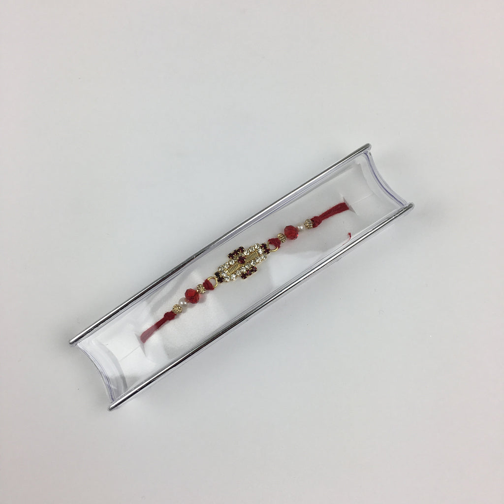 Single Red Thread Gold Cross Shaped Rakhi With Pearls -R106