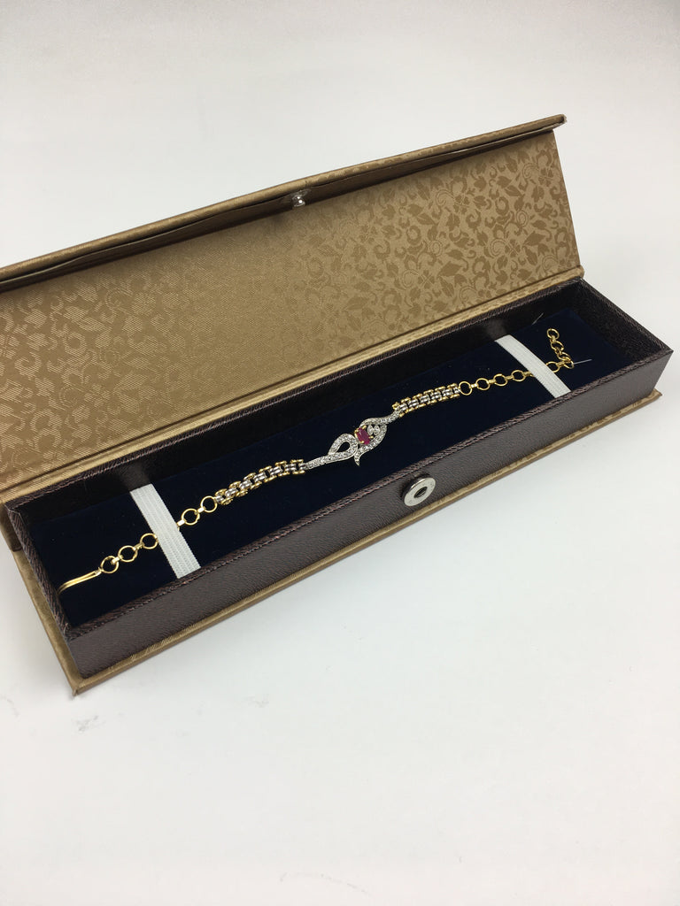 Single Intricate Silver Diamonte Rakhi with a Red Crystal Centre - R121