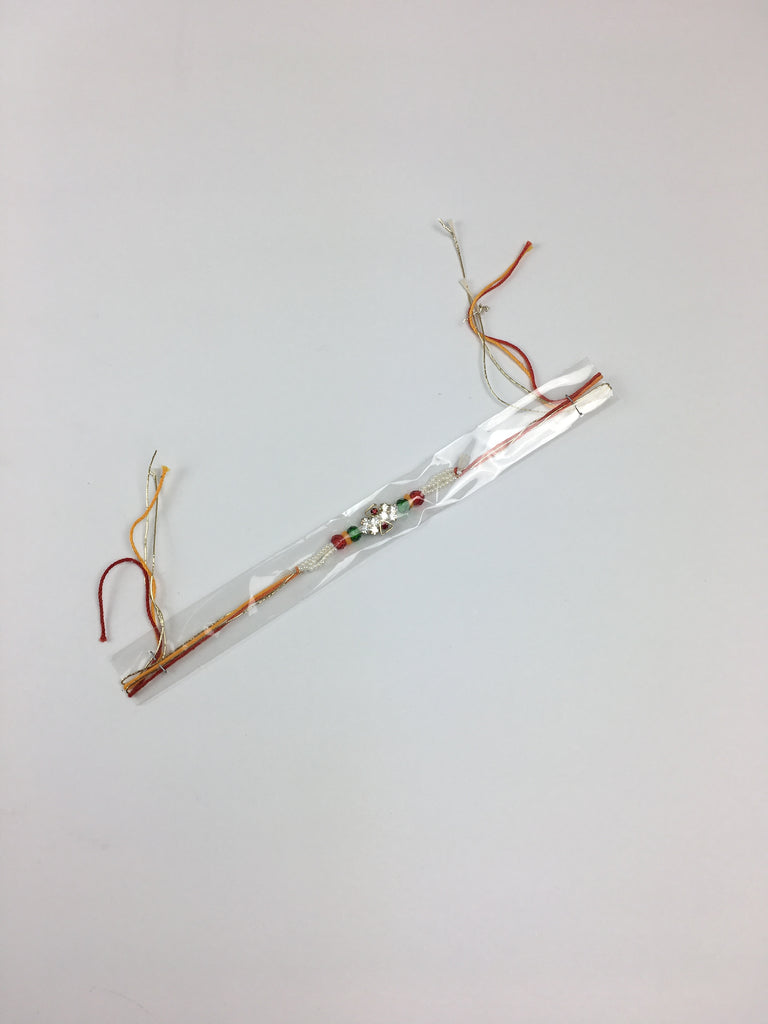 Single Cross Shaped Rakhi With Multicolour Beads And Pearls - R123