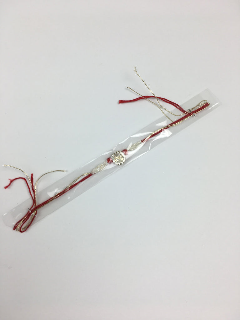 Single Disc Shaped Rakhi With Diamonte Stoning And Pearls - R125